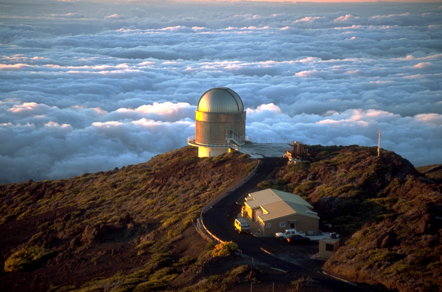 The Nordic Optical Telescope (NOT) telescope at Roque de los Muchachos Observatory in June 2001, by Bob Tubbs, via Wikimedia Commons