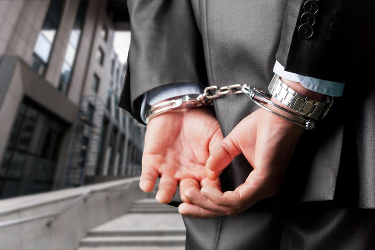 Picture of a man in handcuffs.