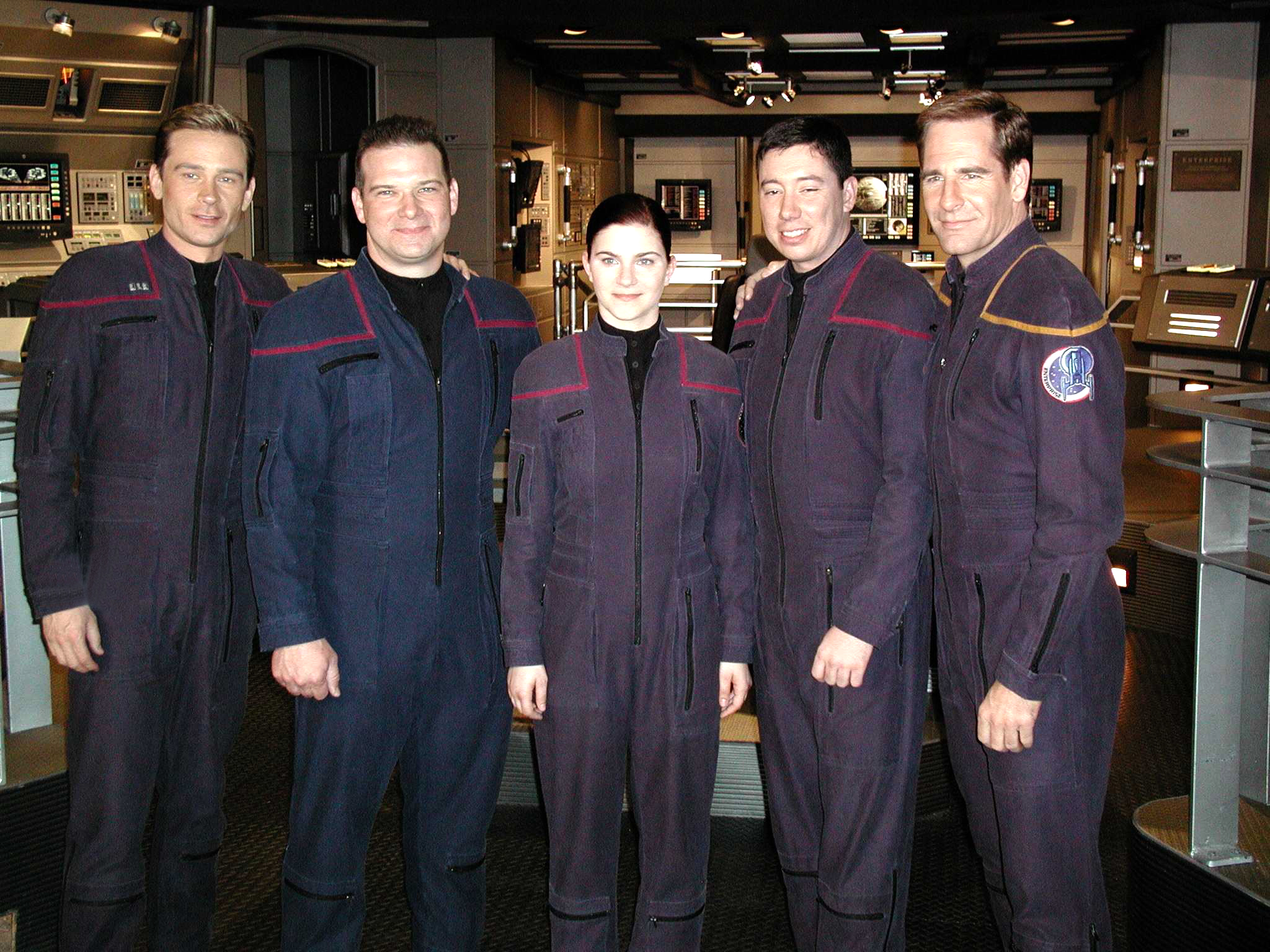 Sailors of the Year for the year 2001 meet cast members of the ‘Star Trek’ television series entitled “Enterprise.” Pictured here on the set of the series are (from left) Conner Trinneer, who plays Chief Engineer Charles “Trip” Tucker, III; Aviation Electronics Technician 1st Class Robert S. Pickering, Sailor of the Year; Personnelman 3rd Class Sarah E. Pizzo, Blue Jacket of the Year; Aviation Electrician’s Mate 2nd Class Timothy J. Whittington, Junior Sailor of the Year; and Scott Bakula, who plays Capt. Jonathan Archer. The three Sailors were given the opportunity to appear in a scene during an episode which aired recently.